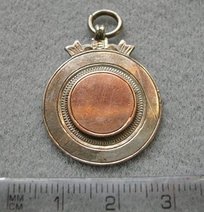 Bland round silver and gold medal