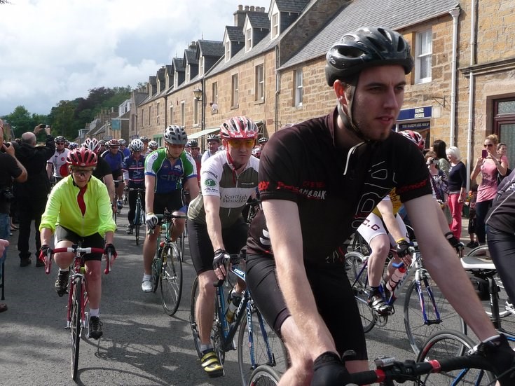 The 'peleton' following Lance Armstrong out of Dornoch