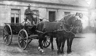 John Gordon driving a cart