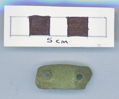 Objects discovered on Pitgrudy Farm - Copper alloy fitting/plate