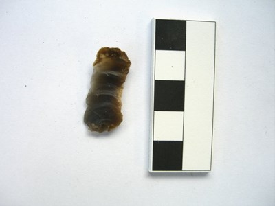 Flint fragment with some rippling on one side
