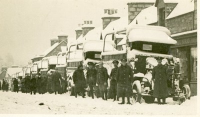 Military trucks parked in Dornoch High Street