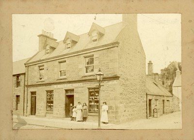W. Macrae's shop with a family group and staff?