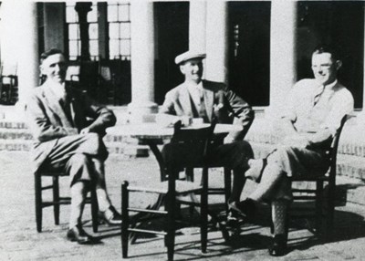 Gentlemen sitting around a table