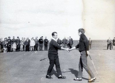 Golfers shaking hands at the Royal Dornoch Golf Cl