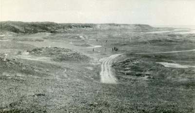 Golfers in small  numbers on the course