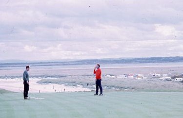 Two golfers on the Royal Dornoch golf course