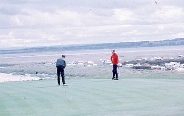 Same two golfers on the Royal Dornoch golf course
