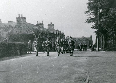 Pipers leading a detachment of troops