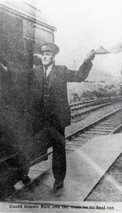 Train guard on the last train from Dornoch