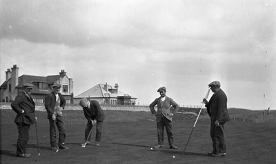 Golfing quartet in front of Grange Road houses