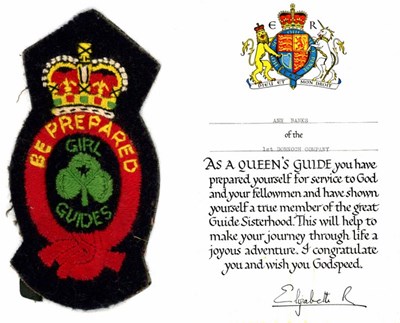 Cert + Queen's Guide Badge presented to Ann Banks 