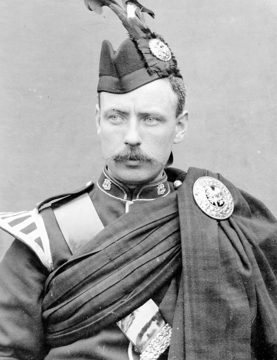Studio photograph of soldier in full dress uniform