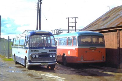 Single deck bus in blue and grey livery at Dornoch