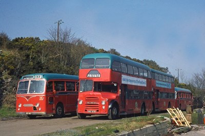 Highland buses in poppy red and blue livery