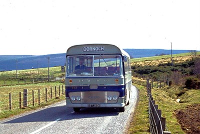 Coach T63 in blue and grey livery near Edderton