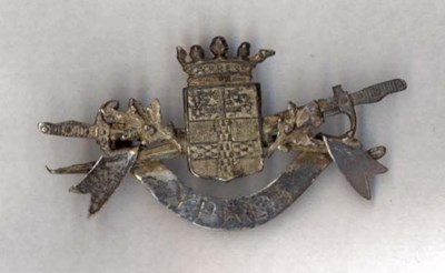 Small metal brooch with scroll inscription Ypres