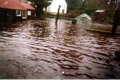 Flooding of a garden in Clashmore in 2004
