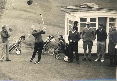 Group of golfers at the first tee.