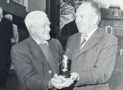J Matheson and R A Murray with a golf trophy
