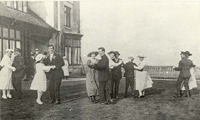 Photograph of group of dancers outside Briarfield.