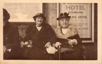 Two ladies sitting on Dornoch Station