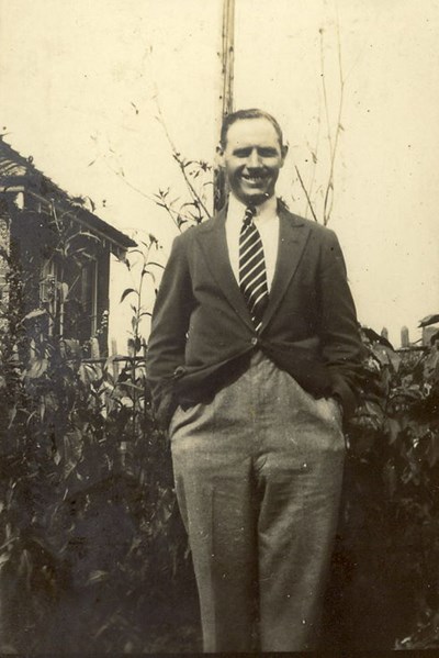 Gentleman standing in a garden