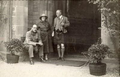 Two Gentlemen and a Lady, thought to be at the entrance to Skibo Castle