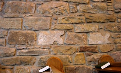 Re-used stone in Dornoch Cathedral Nave