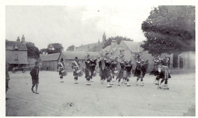 Donoch Pipe Band on parade in The Square, Dornoch c 1910
