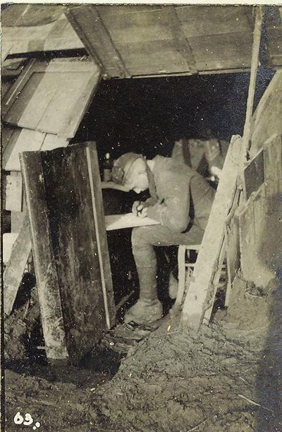 Copying a map of the trenches in H.Q. Mess Hut