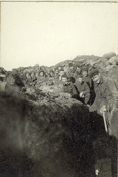 ‘A’ Company’s trenches shoveling out the mud