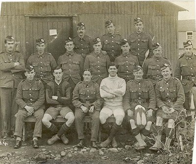 Group photograph of soldiers outside billet
