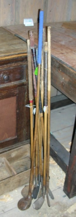 Set of eight wooden shafted golf clubs