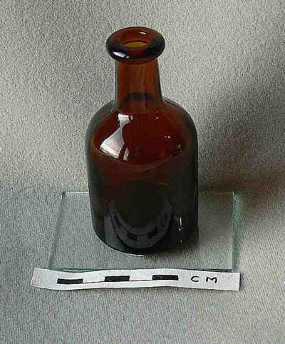 Small round brown bottle