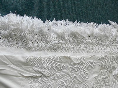 White fringed border to mort cloth