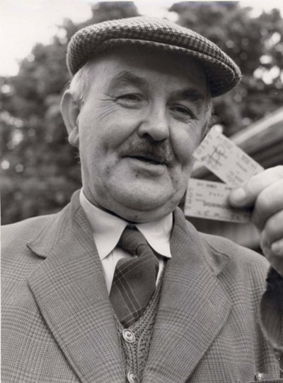 Angus Munro with railway tickets for last Dornoch train