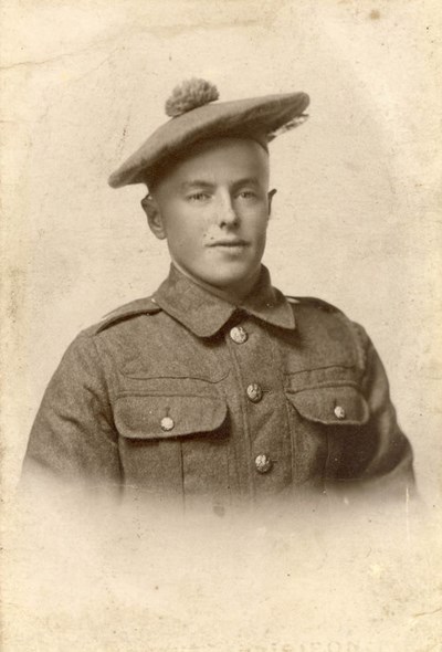 Monochrome photograph of soldier in WW1 style uniform