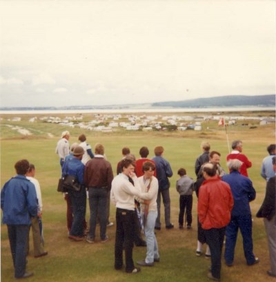 Spectators following Greg Norman playing at Royal Dornoch July 1984